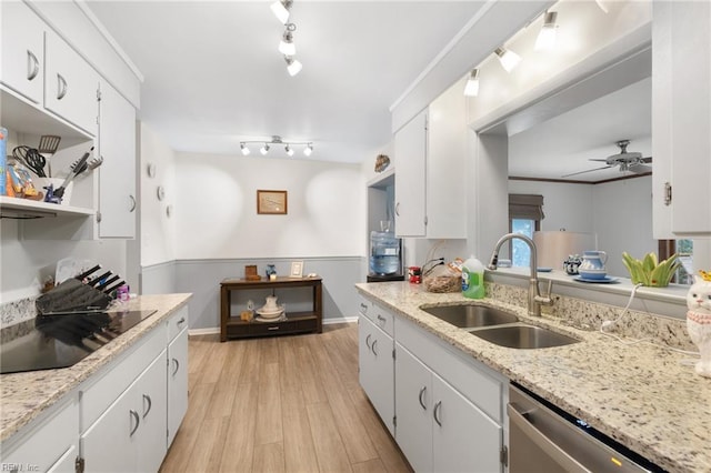 701 Milton Dr, Hampton, VA 23666 - kitchen featuring black electric stovetop, light wood-style floors, a ceiling fan, and white cabinets