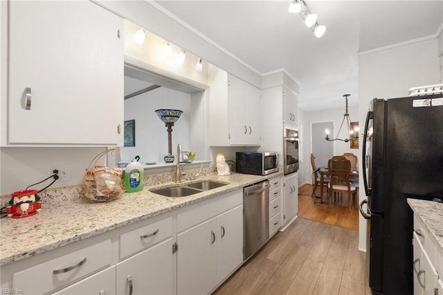 701 Milton Dr, Hampton, VA 23666 - kitchen with stainless steel appliances, white cabinetry, light wood finished floors, a chandelier, and crown molding