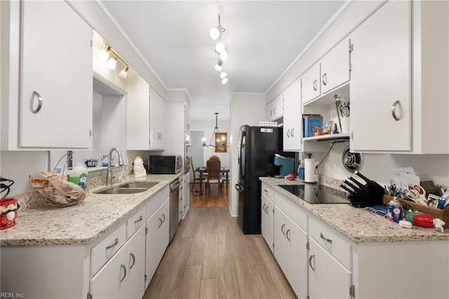 701 Milton Dr, Hampton, VA 23666 - kitchen featuring black appliances, white cabinets, and light wood finished floors