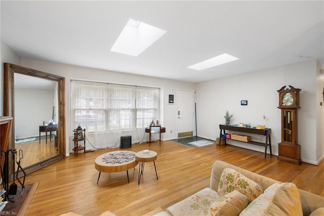 701 Milton Dr, Hampton, VA 23666 - living area featuring a skylight and light wood finished floors