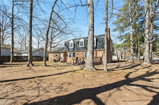 1 Iris Ln, Newport News, VA 23608 - back of property with a chimney and brick siding