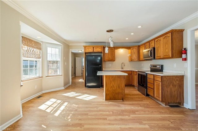 1 Iris Ln, Newport News, VA 23608 - kitchen with appliances with stainless steel finishes, light wood finished floors, a kitchen island, light countertops, and crown molding