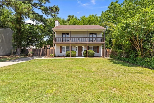 128 Glen Echo Dr, Norfolk, VA 23505 - traditional home featuring a chimney, a porch, concrete driveway, and a balcony