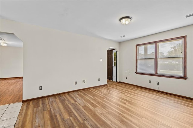 128 Glen Echo Dr, Norfolk, VA 23505 - unfurnished room with arched walkways and light wood-style flooring