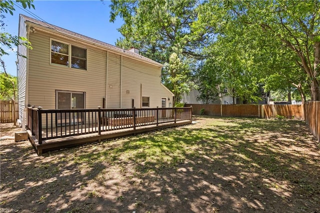 128 Glen Echo Dr, Norfolk, VA 23505 - rear view of property featuring a fenced backyard, a deck, and a chimney