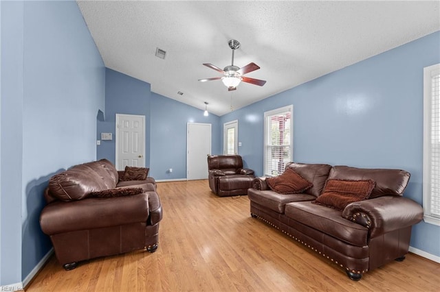 1801 Cougar Ct, Virginia Beach, VA 23456 - living area with ceiling fan, vaulted ceiling, light wood-style floors, a textured ceiling, and arched walkways