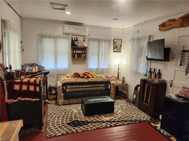 168 N County Dr, Wakefield, VA 23888 - sitting room featuring an AC wall unit and hardwood / wood-style flooring
