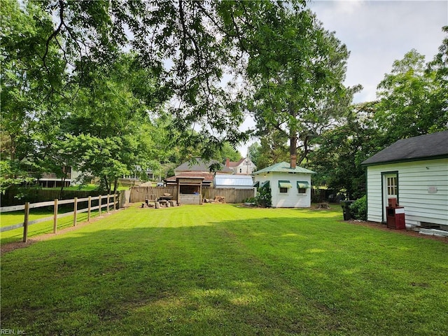 168 N County Dr, Wakefield, VA 23888 - view of yard featuring an outbuilding
