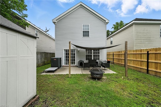 742 Milby Dr, Chesapeake, VA 23325 - back of property with a patio, a fenced backyard, an outdoor living space with a fire pit, and a storage unit