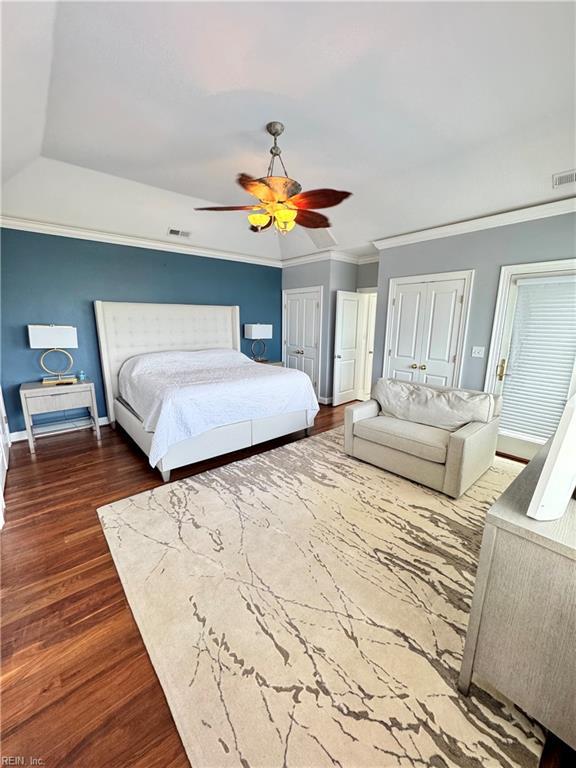 508 Virginia Dare Dr, Virginia Beach, VA 23451 - bedroom with two closets, wood finished floors, ceiling fan, and ornamental molding