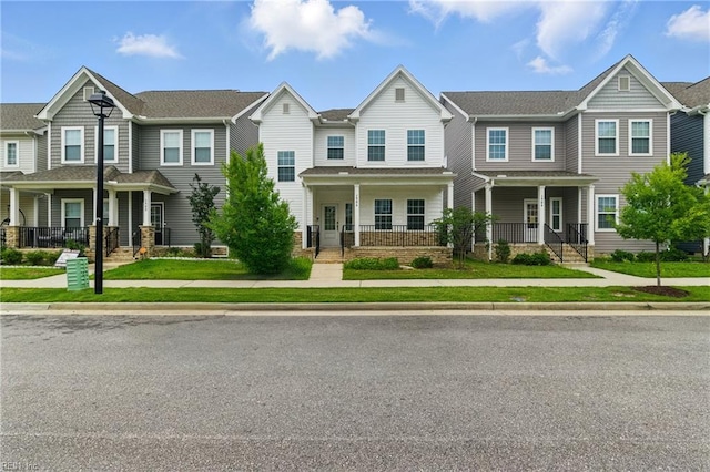 1506 Waltham Ln, Newport News, VA 23608 - townhome / multi-family property with a porch