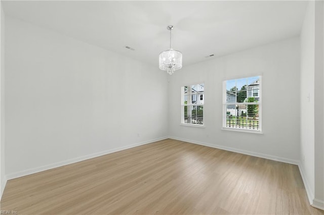 1506 Waltham Ln, Newport News, VA 23608 - empty room featuring a chandelier and light wood-style floors