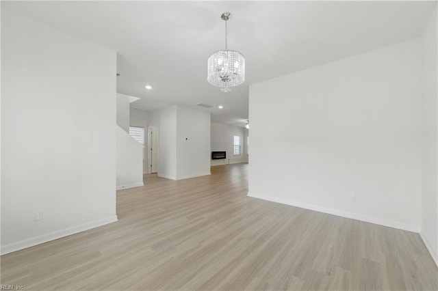 1506 Waltham Ln, Newport News, VA 23608 - unfurnished living room with a chandelier, light wood-type flooring, and recessed lighting