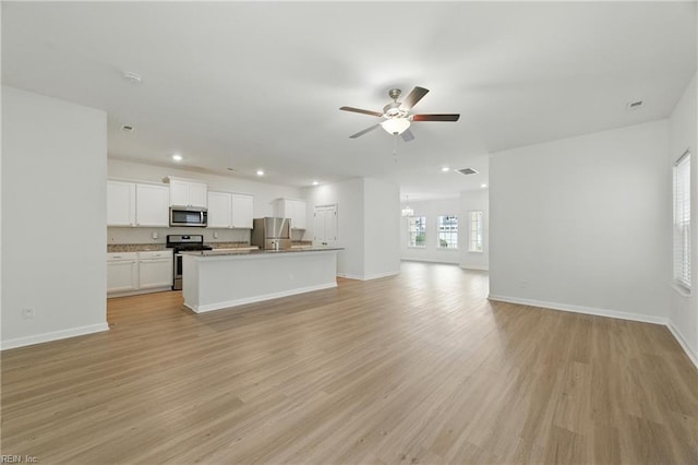 1506 Waltham Ln, Newport News, VA 23608 - unfurnished living room featuring a ceiling fan, recessed lighting, and light wood-type flooring