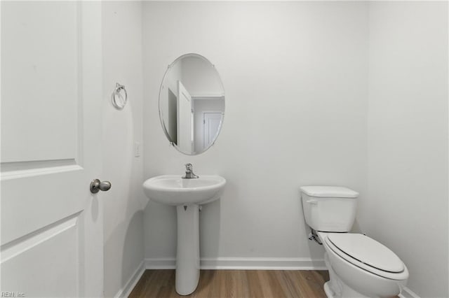 1506 Waltham Ln, Newport News, VA 23608 - half bathroom with toilet and wood finished floors