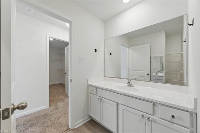 1506 Waltham Ln, Newport News, VA 23608 - bathroom featuring vanity and a walk in closet