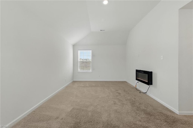 1506 Waltham Ln, Newport News, VA 23608 - additional living space with light colored carpet, vaulted ceiling, heating unit, a glass covered fireplace, and recessed lighting