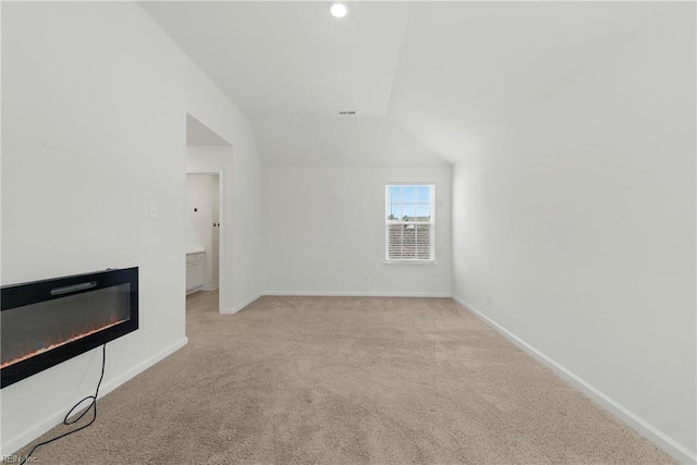 1506 Waltham Ln, Newport News, VA 23608 - bonus room with vaulted ceiling, carpet floors, a glass covered fireplace, and recessed lighting