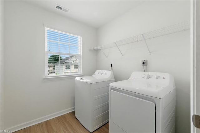 1506 Waltham Ln, Newport News, VA 23608 - washroom featuring washing machine and dryer and light wood-style floors