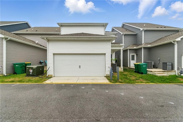 1506 Waltham Ln, Newport News, VA 23608 - back of house with a garage and driveway