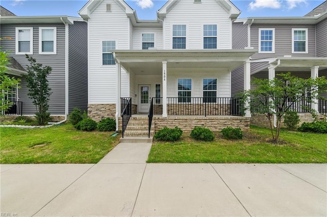 1506 Waltham Ln, Newport News, VA 23608 - view of property featuring covered porch and a front lawn