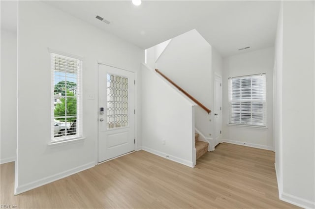 1506 Waltham Ln, Newport News, VA 23608 - foyer entrance with light wood-style flooring and stairway