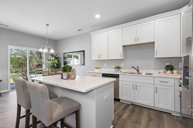 31 Bank St, Windsor, VA 23487 - kitchen with stainless steel dishwasher, healthy amount of natural light, dark wood-type flooring, light countertops, and recessed lighting