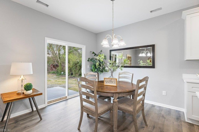 31 Bank St, Windsor, VA 23487 - dining room featuring wood finished floors and a chandelier