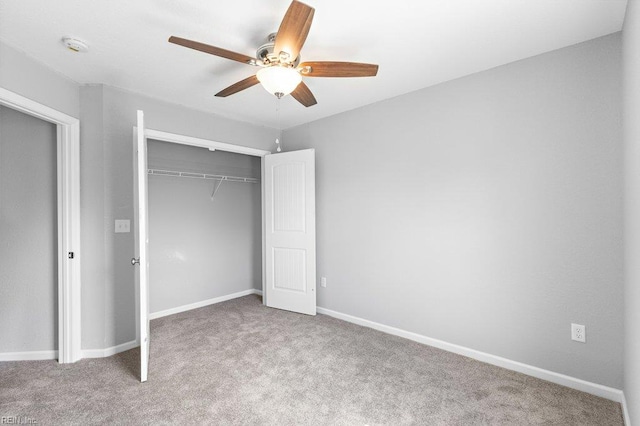 31 Bank St, Windsor, VA 23487 - unfurnished bedroom featuring carpet, a closet, and a ceiling fan