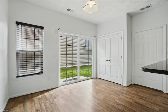 3494 Prices Fork Blvd, Suffolk, VA 23435 - unfurnished bedroom with wood finished floors, access to outside, and a closet
