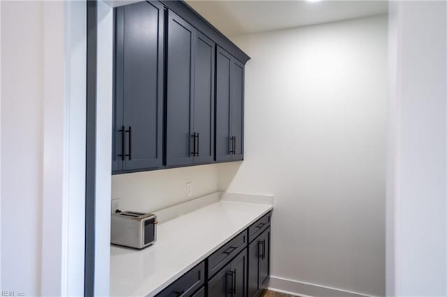 18052 Foxfire Trl, Windsor, VA 23487 - bar area featuring baseboards
