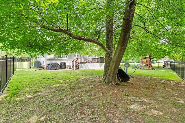15110 Ashby Way, Carrollton, VA 23314 - fenced backyard with a playground and a deck