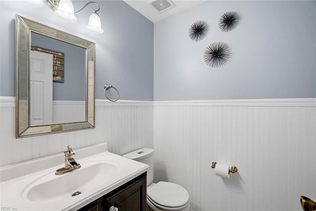 15110 Ashby Way, Carrollton, VA 23314 - half bath featuring a wainscoted wall and vanity