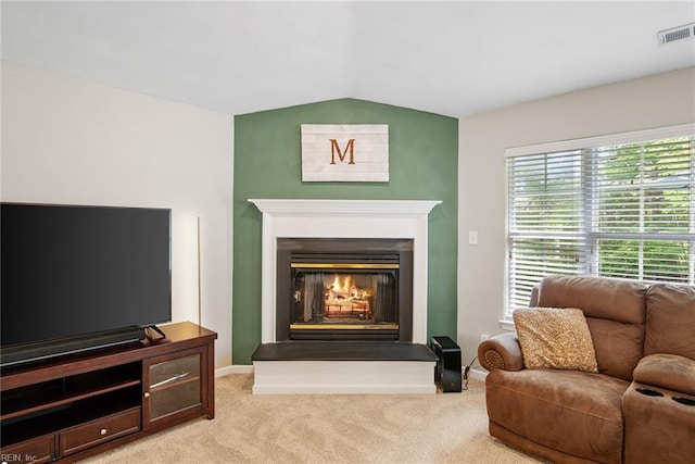 15110 Ashby Way, Carrollton, VA 23314 - carpeted living room with lofted ceiling and a glass covered fireplace