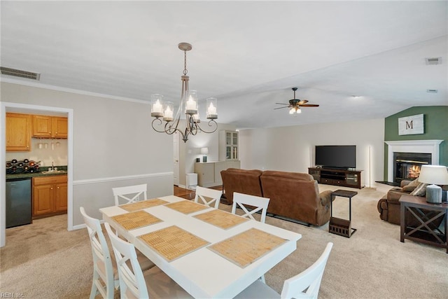 15110 Ashby Way, Carrollton, VA 23314 - dining room featuring light carpet, ceiling fan, a glass covered fireplace, ornamental molding, and a chandelier