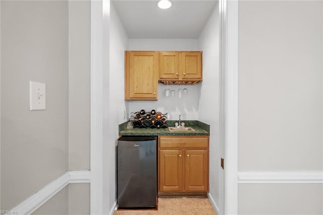 15110 Ashby Way, Carrollton, VA 23314 - indoor wet bar with refrigerator and baseboards