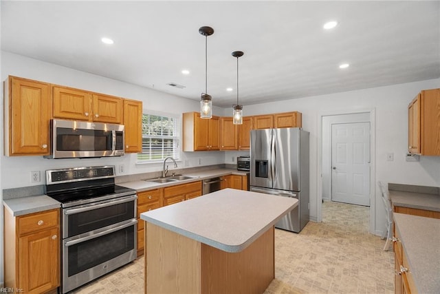 15110 Ashby Way, Carrollton, VA 23314 - kitchen with appliances with stainless steel finishes, recessed lighting, light countertops, a center island, and decorative light fixtures