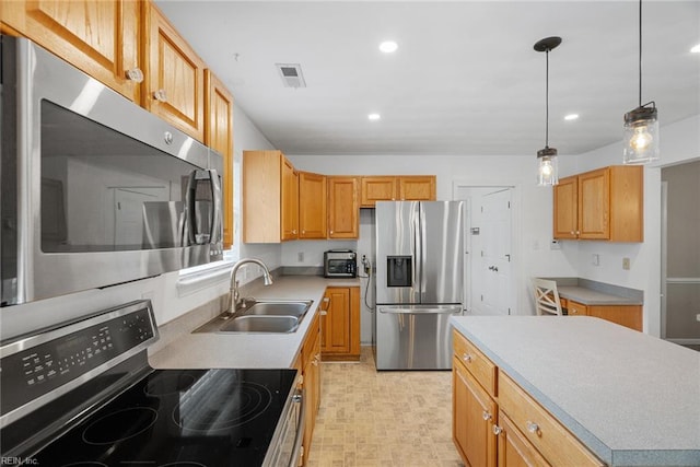 15110 Ashby Way, Carrollton, VA 23314 - kitchen with stainless steel appliances, recessed lighting, pendant lighting, light countertops, and a center island