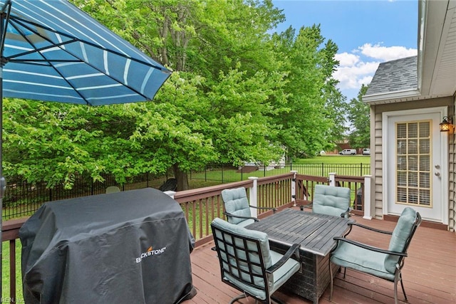 15110 Ashby Way, Carrollton, VA 23314 - deck with a grill, outdoor dining area, and a fenced backyard