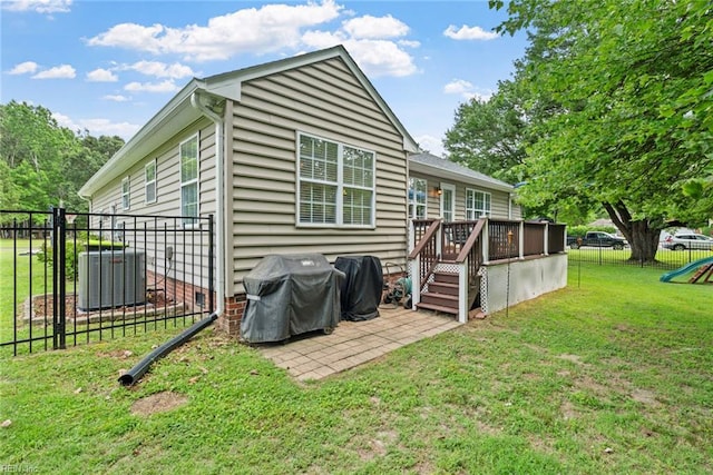 15110 Ashby Way, Carrollton, VA 23314 - back of property with a deck and a patio