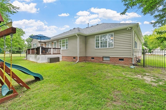 15110 Ashby Way, Carrollton, VA 23314 - rear view of house with crawl space, a fenced backyard, a deck, a playground, and roof with shingles