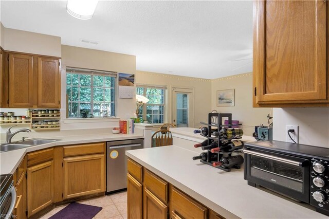 164 Corwin Cir, Hampton, VA 23666 - kitchen with stainless steel appliances, light countertops, and brown cabinetry