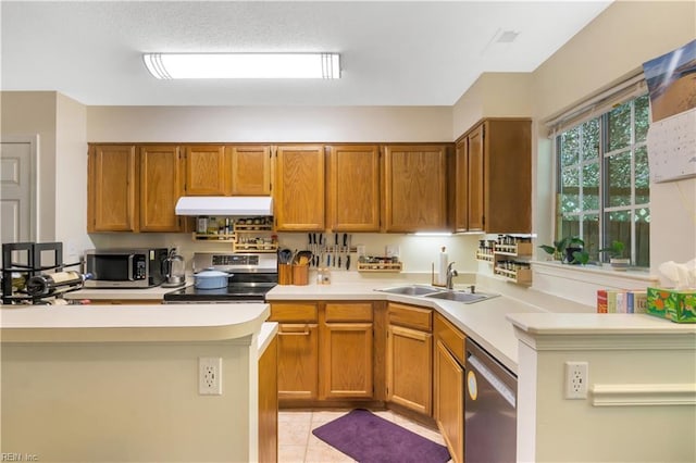 164 Corwin Cir, Hampton, VA 23666 - kitchen with stainless steel appliances, light countertops, under cabinet range hood, and brown cabinets