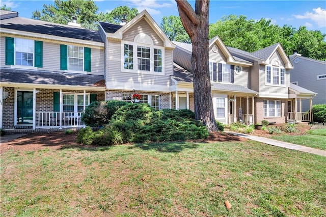 164 Corwin Cir, Hampton, VA 23666 - view of front of property featuring brick siding, a front lawn, and covered porch