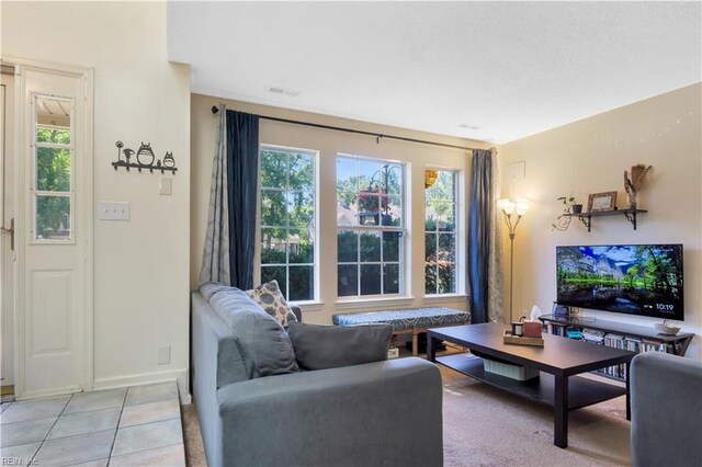 164 Corwin Cir, Hampton, VA 23666 - living room featuring plenty of natural light and light tile patterned floors