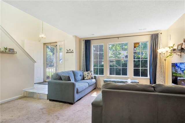 164 Corwin Cir, Hampton, VA 23666 - carpeted living area featuring plenty of natural light and a textured ceiling