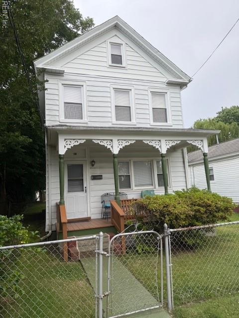 126 E Virginia Ave, Hampton, VA 23663 - view of front of house with covered porch, a fenced front yard, and a gate