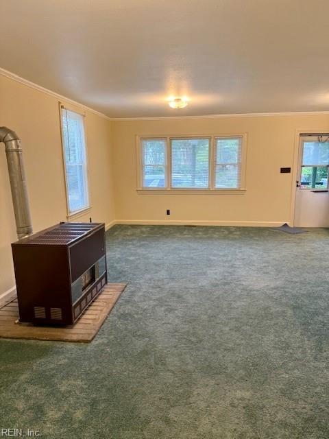 126 E Virginia Ave, Hampton, VA 23663 - unfurnished living room with ornamental molding and dark carpet