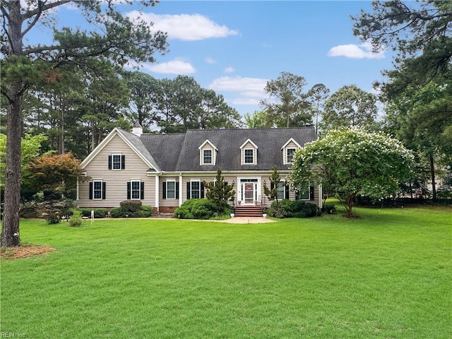 229 Skipjack Ln, Hallieford, VA 23068 - cape cod house with a front yard and a chimney