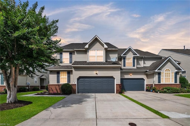 1010 Legends Way, Suffolk, VA 23435 - view of front of home with brick siding, driveway, a garage, and a lawn